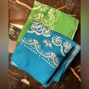 Pair of used novelty paisley bandanas. Green and blue. 21” square.